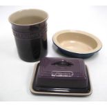 A Le Creuset butter dish, a Le Creuset utensil pot and a Le Creuset small oval dish (3).