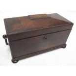 A Regency rosewood sarcophagus tea caddy with two divisions and central mixing bowl, standing on bun