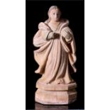 A 17th / 18th century carved wooden figure in the form of a Saint, 43cm high.