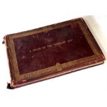 A Victorian leather bound photo album 'A Cruise on the Midnight Sun'.