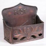 An Art Noveau style copper post box, 23cm wide.