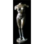 A classical Grecian style bronze sculpture of a female torso, on a circular plinth (unsigned),