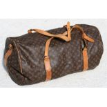 A Louis Vuitton (type) Monogram Sac Polochon 65 travel duffle bag, 73 by 49cms.