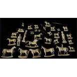 A Regency period miniature carved ivory fox hunting group including figures, hounds, horses and