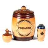 A Victorian Doulton Lambeth stoneware tobacco pot, 14cm high, and a Doulton Lambeth miniature jug