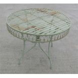 A circular painted metal garden table, 95cm diameter.