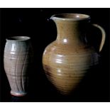 A Studio pottery jug, 28cm high, together with a Studio pottery vase, 20cm high.