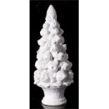 A white glazed Contential pottery centrepiece in the form of a tower of fruit, 55cm high.