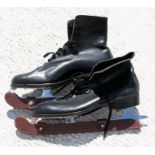 A pair of John Wilson Coronation leather ice skates.