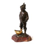 A late 19th century bronze group of a young boy with a gilded duck mounted on a marble base,