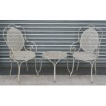 A pair of white painted metal garden chairs and matching table (3).