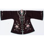A Chinese silk short robe, embroidered with scrolling flowers and butterflies, on a deep purple