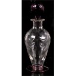 An Art Glass decanter with purple blown stopper and ground out pontil mark, possibly Whitefriars,