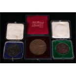 Three cased bronze medallions - a 1911 King George V Coronation medallion, 4cm diameter; a 1913