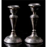 A pair of silver candlesticks, 12cm high, Chester 1913.