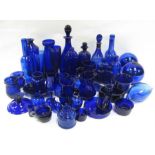 A quantity of blue glass items including a Bristol blue glass brandy decanter; a similar Hollands