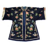 A Chinese silk winter robe, embroidered with flowers on a deep blue ground.