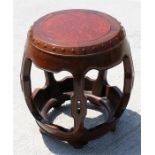 A Chinese hardwood drum stool, with inset burrwood top, 41cm diameter, 43cm high.