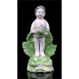 An 18th century Staffordshire Pearlware figure of a young child holding a basket of flowers, 9cm