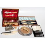 A Victorian silver mounted ivory handled carving set in oak case; a cased set of silver handled