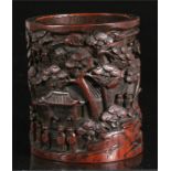 A Chinese bamboo brush pot, deeply carved with figures in procession and prunus 13cm diameter and