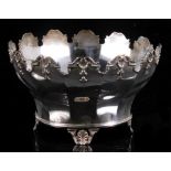 An early 20th century silver rose bowl of Monteith form, with shell and scroll cast rim and feet and