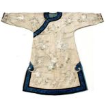 A Chinese silk long robe embroidered with a central stylised bat roundel, flowers and butterflies,