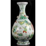 A large Chinese famille verte vase, decorated with warriors on horseback, with two lion mask handles