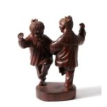 A mid 20th Century Chinese Republic figural hardwood carving, depicting two girls dancing 15cm high