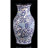 A Vietnamese vase, decorated flowers and foliate scrolls, 30cm high.