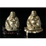 A Chinese brass Buddha on a pierced hardwood stand, together with another similar 13cm high