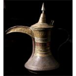 A large copper & brass Middle Eastern Dallah or coffee pot, 52cm high.