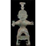 An archaic style Chinese bronze figure, kneeling on a stand, 45cms (17.7ins) high.