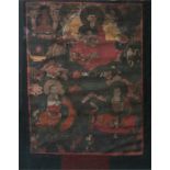A Tibetan Thangka painting, depicting various Buddhist deities, framed and glazed, (glass cracked to