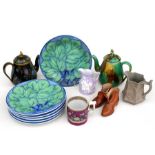 A majolica teapot, a set of six cabbage plates, a pair of miniature ceramic boots, and other