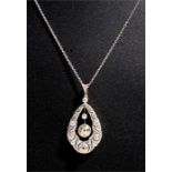 A diamond pendant necklace, the central brilliant cut diamond suspended within a pear shaped