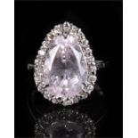 An 18ct white gold diamond and kunzite ring, the large central pear shaped kunzite (approx 6ct)