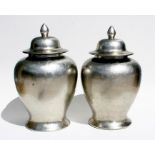 A large pair of modern silvered jars and covers, 63cms high.