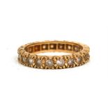 An 18ct gold eternity ring.