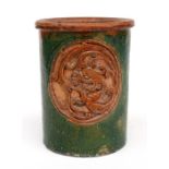 A Chinese Tang Dynasty bitong brush pot of cylindrical form, with central medallion and decorated