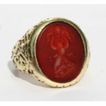 A 19th century heavy 14ct gold carnelian set oval intaglio seal ring.