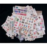 A quantity of loose stamps including Chinese examples.