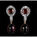 A pair of garnet cabochon & diamond drop earrings.