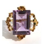 A modernist 14ct gold and amethyst ring, the baguette cut amethyst approximately 5.7ct.