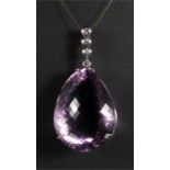 A large 18ct white gold amethyst and diamond pendant, the large pear shaped faceted amethyst (approx