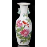 A late 19th century Chinese Kangxi vase decorated with a bird and flowers, with calligraphy to