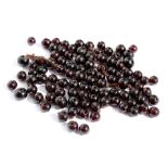 A quantity of loose garnet beads, weight 45.9g.