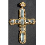 An early 19th century 18ct gold cannetille and moonstone crucifix pendant, set with large oval and