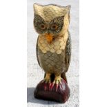 A large carved and painted wooden owl, 73cms (28.75ins) high.