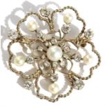 A diamond & pearl brooch in a circular floral design, set with six pearls & twenty diamonds, 4cms